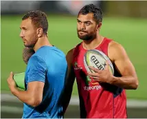  ?? GETTY IMAGES ?? Quade Cooper, left, and Karmichael Hunt are on the outer.