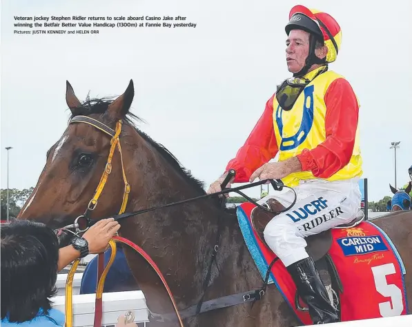  ?? Pictures: JUSTIN KENNEDY and HELEN ORR ?? Veteran jockey Stephen Ridler returns to scale aboard Casino Jake after winning the Betfair Better Value Handicap (1300m) at Fannie Bay yesterday