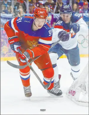  ?? Mark Humphrey The Associated Press ?? Vladimir Tarasenko, front, played for Russia in the 2014 Games. The Blues forward wanted the chance to play in Beijing in February.