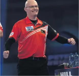  ??  ?? Sixth time lucky: Mickey Mansell celebrates his first win at the world championsh­ips