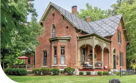  ??  ?? Above: Charlene and Tom quickly fell in love with the stately 1841 brick farmhouse featuring a patterned slate roof. The couple spend many a summer day out on the deck, enjoying the verdant landscape.