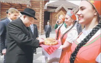  ??  ?? North Korean leader Kim Jong Un tries a pastry as Governor of Primorsky Region Oleg Kozhemyako watches, in this undated photo released by North Korea’s Central News Agency (KCNA). — Reuters photo