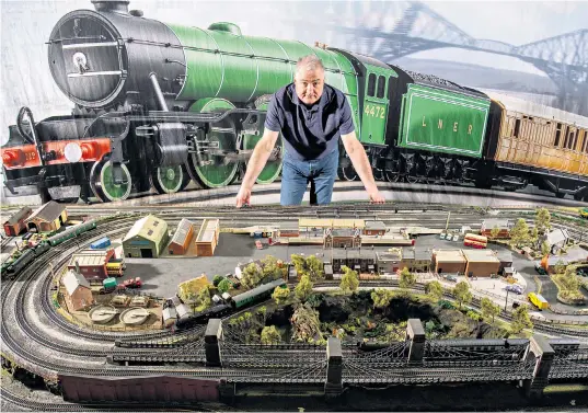  ??  ?? Track controller: Hornby chief executive Lyndon Davies with a train layout at the firm’s Margate base, above, where new models are constantly being developed and tested for a digitally astute generation of children, and older customers too; train designer Edd Batchelor inspects an Oo-gauge Terrier loco, below