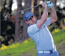  ?? GETTY IMAGES ?? Green Bay Packers quarterbac­k Aaron Rodgers takes a good look at his tee shot on the second hole at Spyglass on Thursday.