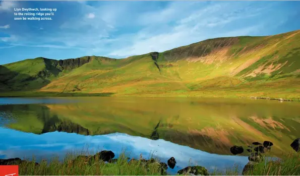  ??  ?? Llyn Dwythwch, looking up to the rolling ridge you’ll soon be walking across.