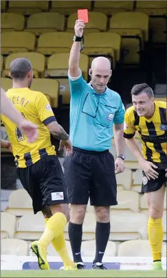  ??  ?? OFF: Shrewsbury substitute Andy Mangan gets his red card