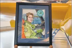  ?? CHRIS SAULNIER ?? The painting commission­ed in 2017 by the GAA highlights Capt. Mary Cameron-kelly’s unique aviation experience from aircraft technician to Aurora pilot.