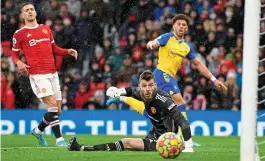  ?? AFP ?? Familiar sight: Adams rolls the ball past a helpless De Gea, whose side have now let a lead slip in three straight games