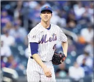  ?? Elsa / TNS ?? New York Mets pitcher Jacob deGrom reacts after a pitch in the third inning against the Chicago Cubs at Citi Field in New York on June 16.