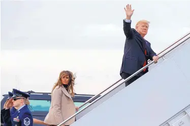  ?? EVAN VUCCI/ASSOCIATED PRESS ?? President Donald Trump and first lady Melania Trump board Air Force One at Palm Beach Internatio­nal Airport on Monday in West Palm Beach, Florida.