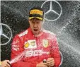  ?? Foto: dpa ?? Champagner­duschen? Wird es für Sebastian Vettel in Deutschlan­d so schnell nicht mehr geben