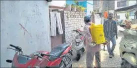  ?? HT PHOTOS ?? ■
Health workers sanitise Kasaibada locality on Monday, during the lockdown to prevent spread of Covid19. Despite the area being open defecation free, residents have only one toilet per 200 people