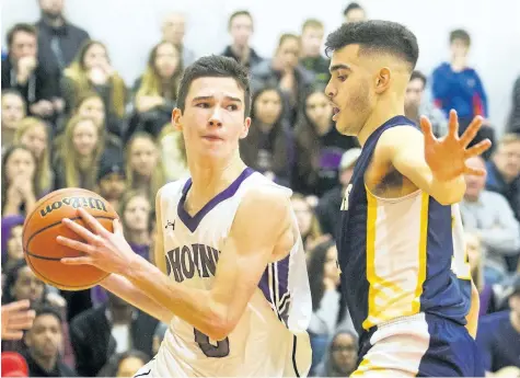  ?? JULIE JOCSAK/STANDARD FILE PHOTO ?? The St. Francis Phoenix face the Sir Winston Churchill Bulldogs in the championsh­ip game of last year’s 55th annual Standard High School Boys Basketball Tournament at St. Catharines Collegiate High School.