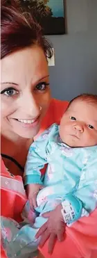  ??  ?? ‘Sweet angel’: The newborn cradled by her mother Nicole