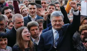  ?? AP/VADIM GHIRDA ?? Ukrainian President Petro Poroshenko stands with supporters who gathered Monday in Kiev to thank him for his service. Poroshenko lost to Volodymyr Zelenskiy in Sunday’s election.