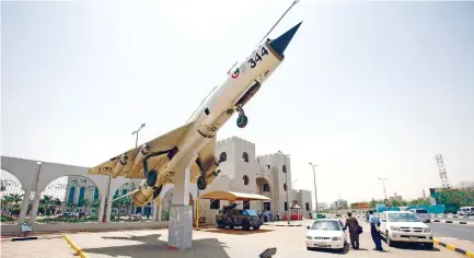  ??  ?? A MiG-21 is seen at the entrance of a conference center where acting chief of staff of Sudanese air force delivered a press conference in Khartoum on Sunday, ahead of joint air force drill with Saudi Arabia. (AFP)