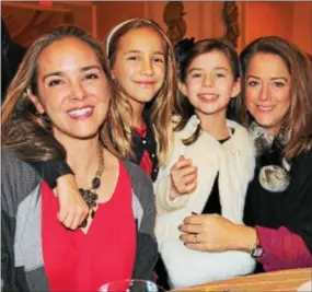  ??  ?? Sara Glaser of Wynnewood and daughter, Gabrielle, enjoy the Bellevue’s brunch with Berwyn residents Mia and Mimi Greenly.