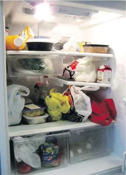  ?? — THE ASSOCIATED PRESS FILES ?? In the realm of office politics, nothing stirs up conflict quite like the office fridge, a cold war waged with passive aggressive Post-it notes and decomposin­g leftovers.