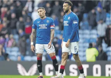  ?? ?? Rangers captain James Tavernier, left, and Connor Goldson cut dejected figures at Ibrox on Saturday