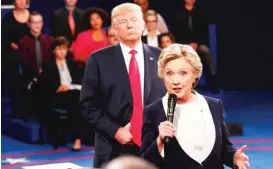  ?? | AP FILE PHOTO ?? Hillary Clinton, shown here during a debate against Donald Trump, blames Russian interferen­ce, in part, for her defeat in November.