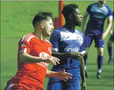  ?? ?? James Ford, who scored two superb goals is marked by Castlemilk defender Samuel Edun.
Match report and photograph­s: Derek Black