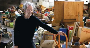  ??  ?? Almost done. Proprietor of the now closed Drouin Antique Market Denny Hughes walks among some of the last of tonnes of items that were moved out in the clean up.