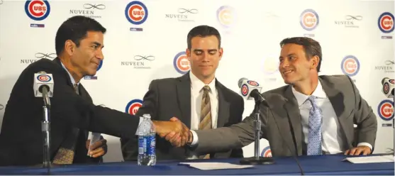  ?? SUN-TIMES ?? The Theo Trio — Jason McLeod (from left), Theo Epstein and Jed Hoyer — might be losing a member. McLeod is rumored to be a candidate for GM gigs with the Giants and Mets.