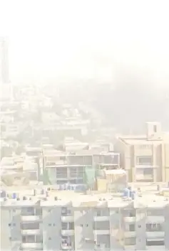  ??  ?? Smoke rises from the Chinese consulate after an attack by gunmen in Karachi. — Reuters photo