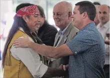  ?? RYAN REMIORZ CANADIAN PRESS FILE PHOTO ?? Grand Chief Serge Simon, left, shakes hands with Oka Mayor Pascal Quevillon in Kanesatake, Que., in 2015. They shook hands again Friday for the first time since tensions erupted in July over a land dispute.