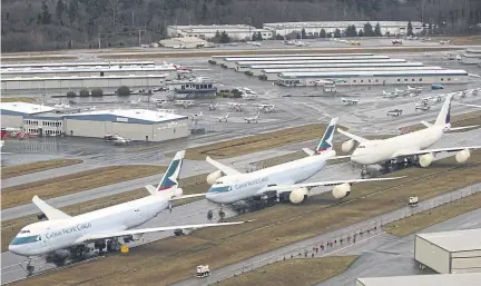  ?? AFP ?? In this file photo, in-production Boeing 747 aircraft for Cathay Pacific sit on the tarmac at Boeing Co’s production facilities at Paine Field in Washington. The Boeing 747 has become the plane of American presidents and mass tourism, but it is about to bow out almost 50 years after its first flight.