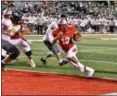  ?? BRITTANY CHAY — THE NEWS-HERALD ?? Mentor’s Chris Edmond scores a touchdown during the Cardinals’ 49-14 win over visiting Medina on Sept. 29.