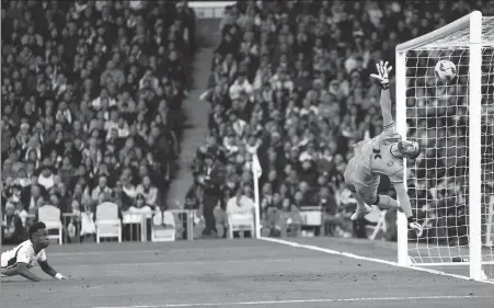  ?? AP ?? Real Madrid's Vinicius Junior (left) scores his side's second goal during a Spanish La Liga soccer match between Real Madrid and Almeria at the Santiago Bernabeu stadium on Sunday.