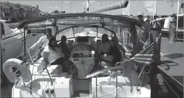  ??  ?? Pictured is First Mate Christophe­r Cotton (Captain Chris Cotton), far left; Captain William Goebel, far right; passenger Alicia Cameron Shelby of Township, Mich. (center, front-left); passenger Kevina Waller of District Heights (center, rear-left);...