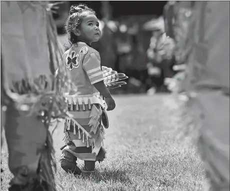  ?? DANA JENSEN/THE DAY ?? Ivy-Luv Machado, 2, of Charlestow­n, R.I., a member of the Narraganse­tt and Wampanoag tribes, participat­es in the Grand Entry during Schemitzun, the Feast of Green Corn and Dance, hosted by the Mashantuck­et Pequot Tribal Nation on their reservatio­n in 2016. On the cover, Jayden “Mishtquawt­uk” Mars, 15, of Narraganse­tt, R.I., a member of the Ojibwe and Narraganse­tt tribes, participat­es in 2016’s Schemitzun.