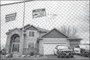  ?? JOHN MINCHILLO/AP PHOTO ?? Fencing and concrete barriers surround the home of Kim Potter as police guard her residence Wednesday.