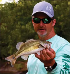  ?? Arkansas Democrat-Gazette/BRYAN HENDRICKS ?? Using soft plastic lures and hard topwater baits, Mike Burnham and the author caught a mess of Kentucky bass Monday on the Saline River near Benton.