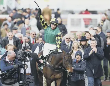  ??  ?? 0 Adam Wedge and Lisnagar Oscar are led back to the Winners’ Enclosure after their triumph.