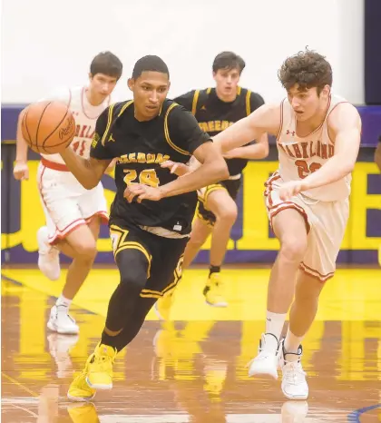  ?? AMY SHORTELL/THE MORNING CALL ?? Freedom's Isiah Cedano drives down the court as Freedom plays Parkland at Notre Dame-Green Pond on Friday night.