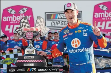  ?? BUTCH DILL/AP PHOTO ?? Joey Logano celebrates in Victory Lane after winning Sunday’s NASCAR race at Atlanta Motor Speedway.