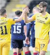  ??  ?? Top man Jon Guthrie (right) after Ross County win