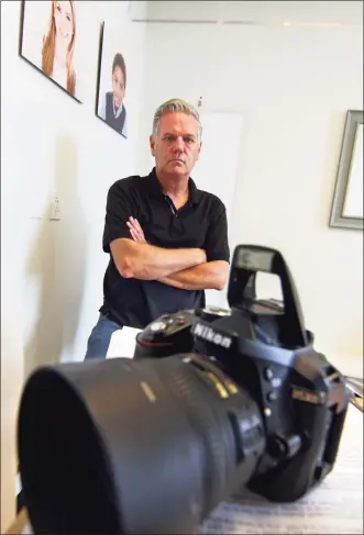  ?? Christian Abraham / Hearst Connecticu­t Media ?? Passport Pro owner Kurt Olson in his store at 850 Canal St. in Stamford, next to the Connecticu­t Passport Agency on Wednesday.