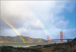  ?? Brian van der Brug Los Angeles Times ?? RAINBOWS over the Golden Gate Bridge. Lawmakers are considerin­g asking voters to put the right to clean air and water into the state Constituti­on.