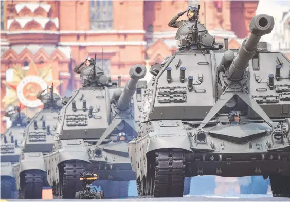  ?? Picture: AFP ?? Russia puts on a ‘mine’s bigger than yours’ show of military might in Red Square against the backdrop of horrific war crimes in Ukraine.