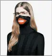  ?? AP ?? A screenshot taken from an online fashion outlet shows the Gucci turtleneck black wool balaclava sweater.