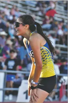  ?? JOHN T. DENNE/Taos News ?? Seeded 5th in the girls 2A 3200M run, Peñasco’s Rochelle Lopez ran a masterful race and surprised the field in winning the event on Saturday (May 7).