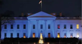  ?? ALEX BRANDON — THE ASSOCIATED PRESS FILE ?? In this file photo, the White House is lit with blue lights in honor of World Autism Awareness Day in Washington. Top U.S. tech executives and researcher­s are gathering at a White House summit, Thursday to press Trump administra­tion officials on...