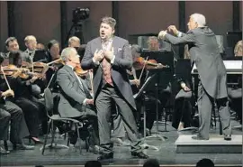  ??  ?? TENOR YUSIF EYVASON, second from right, performs with a pickup orchestra being conducted by Marco Boemi at the Broad Stage in Santa Monica.