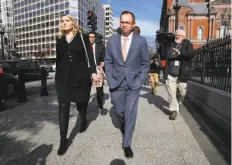  ?? Jacquelyn Martin / Associated Press ?? Mick Mulvaney walks to the Executive Office Building from the Consumer Financial Protection Bureau in Washington. Mulvaney is fighting Leandra English for control of the agency.