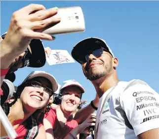  ?? CHARLES COATES/GETTY IMAGES ?? Mercedes driver Lewis Hamilton greets fans at the Spa-Francorcha­mps circuit, ahead of this weekend’s Belgian Grand Prix.