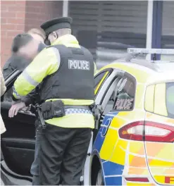  ?? MARK JAMIESON ?? Finbar McCoy Jr arrives at Coleraine Crown Court, and (above) police detain a man after Mr McCoy’s manslaught­er trial